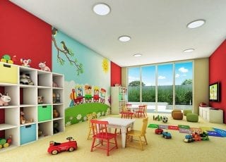 Brinquedoteca colorida e luminosa do Paradise Residence com jogos e espaço para brincadeiras.