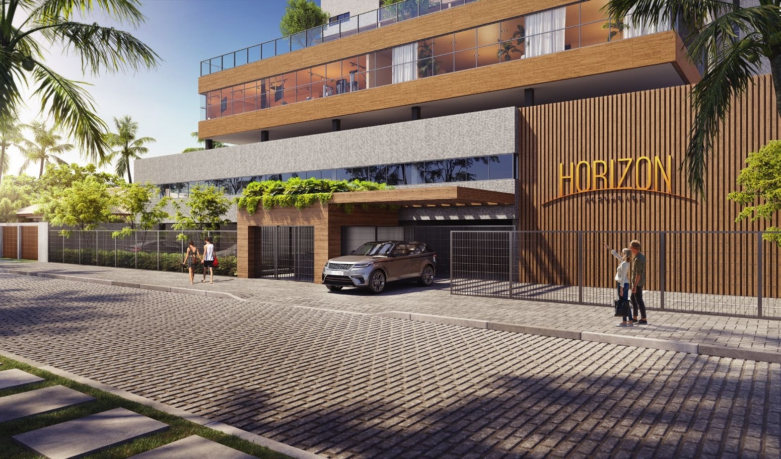 Vista da entrada do HORIZON Jaguaribe na Rua Hugo Sacramento, destacando a arquitetura moderna e a fachada elegante do edifício.