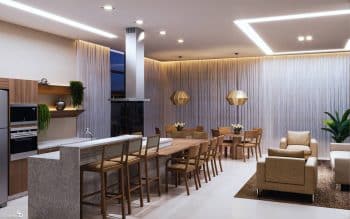 Imagem da perspectiva artística do Espaço Gourmet no PLENO Itaigara, mostrando uma área moderna e bem decorada com mesas, cadeiras e uma cozinha completa.