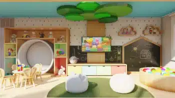 Interior colorido e vibrante da brinquedoteca do Jaguaribe OCEAN SIDE com áreas de jogo, uma televisão, móveis infantis e decoração temática alegre.