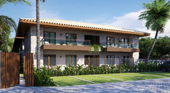 Imagem da fachada do Villa dos Coqueiros destacando sua arquitetura moderna com toques naturais, cercada por palmeiras e vegetação.