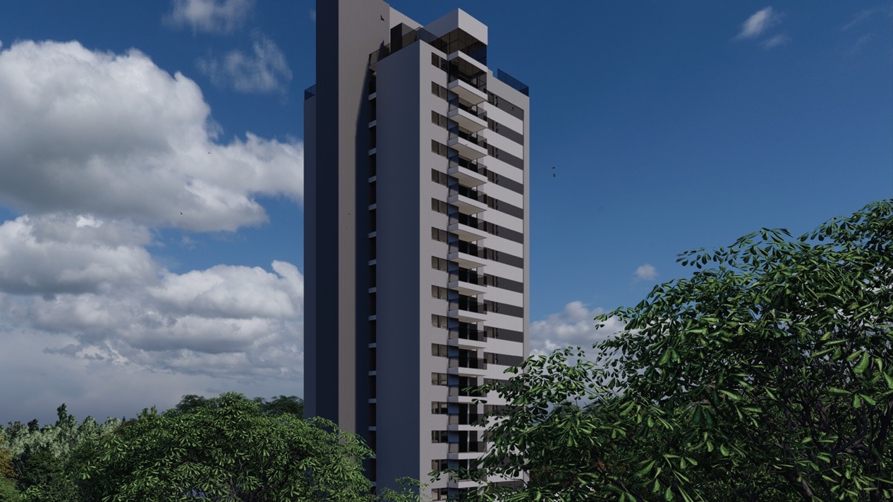 Vista exterior do edifício Jaguaribe OCEAN SIDE, uma torre residencial moderna de cor cinza escuro, contrastando com o céu azul e rodeada por uma vegetação exuberante.