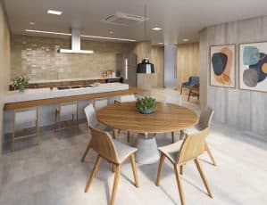 Cozinha gourmet espaçosa com uma ilha central, bancadas elegantes e uma mesa redonda de madeira cercada por cadeiras modernas.