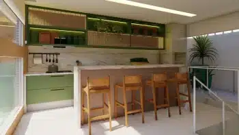 Espaço gourmet moderno no apartamento duplex de 3 quartos do Jaguaribe OCEAN SIDE, com balcão de mármore, armários em tom verde oliva e cadeiras altas de madeira.
