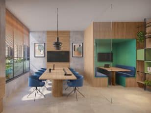 Imagem de um espaço de coworking no Estilo Pituba, com mobiliário contemporâneo. Inclui uma mesa de reunião central com cadeiras azuis e paredes adornadas com painéis de madeira e arte moderna. Há também uma cabine de trabalho privativa com paredes verdes e estantes.