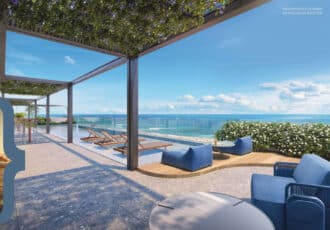 Piscina de borda infinita no rooftop do Terrazza Balena, com espreguiçadeiras, área de convivência e vista deslumbrante para o mar em Salvador.