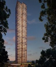 Fachada do Elleve Horto ao entardecer, com torre alta, varandas iluminadas e arquitetura contemporânea cercada por natureza