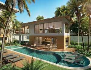 Piscina do ZN Itacim com hidromassagem, deck molhado, espreguiçadeiras e área gourmet integrada, cercada por coqueiros e paisagismo tropical.
