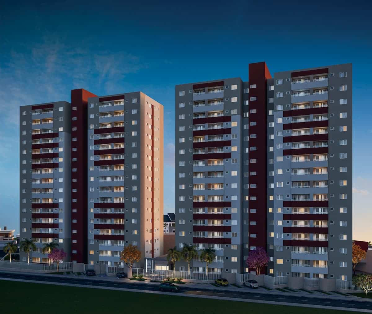 Vista noturna da fachada do Residencial Eloisio Sobral da Silveira com iluminação nas varandas, paisagismo e arquitetura contemporânea em Aracaju.