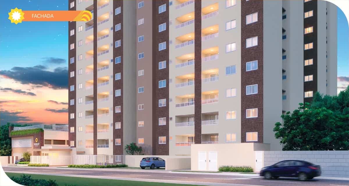 Fachada iluminada do Solare Residence ao entardecer, com torres residenciais modernas e entrada principal destacada.
