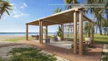 Estrutura de apoio à beira-mar no Riviera Praia do Forte, com área de convivência coberta, mobiliário moderno e vista privilegiada para o mar.