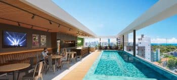 Rooftop do Easy São Lázaro em Salvador, com piscina, bar moderno, mesas de convivência e vista panorâmica para a cidade e o mar.