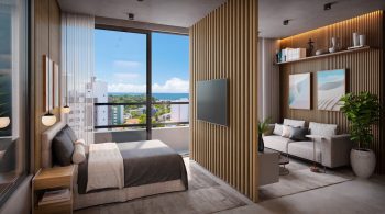 Studio do Easy São Lázaro em Salvador, com quarto e sala integrados por painel de madeira, decoração moderna e ampla janela com vista para o mar.