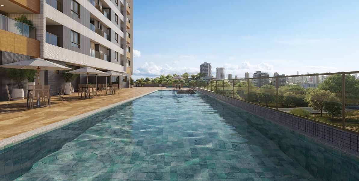 Piscina Adulto e Infantil do Residencial Florença em Salvador Piscina adulto e infantil do Residencial Florença com deck, mesas e vista para a cidade de Salvador em um dia ensolarado.