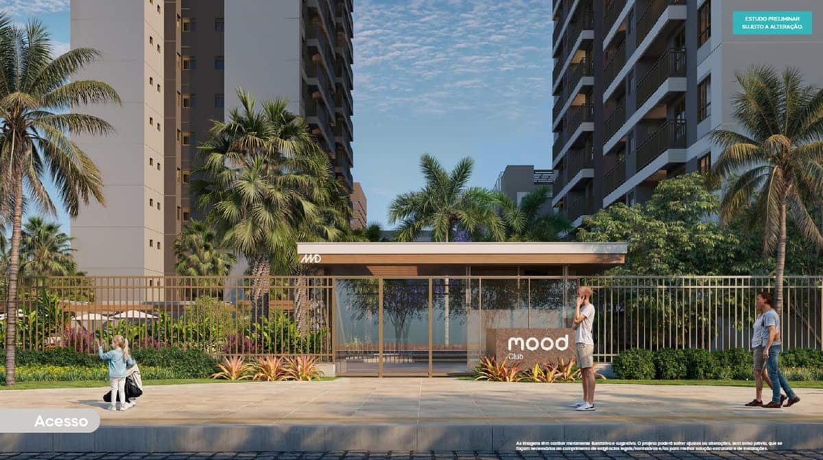Perspectiva da entrada principal do MOOD CLUB, mostrando portaria com design moderno, fachada com paisagismo, guarita de segurança e torres residenciais ao fundo.