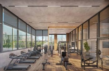 Academia equipada do Lumio Jardim Apipema em Salvador, com esteiras, aparelhos modernos e ampla vista panorâmica.