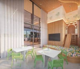 Brinquedoteca do Lumio Jardim Apipema em Salvador, com área lúdica, piscina de bolinhas, escorregador e mesas infantis coloridas.