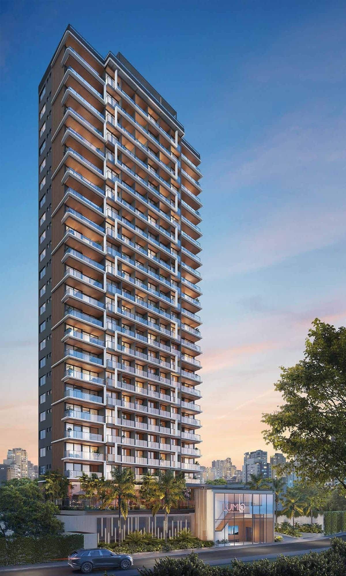 Fachada do edifício Lumio Jardim Apipema em Salvador, torre única com varandas amplas, design contemporâneo e paisagismo na entrada.