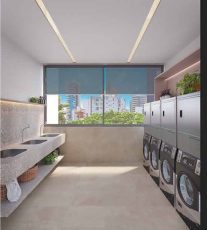 Lavanderia OMO do Lumio Jardim Apipema em Salvador, com máquinas modernas, bancadas de pedra e janelas amplas com vista urbana.