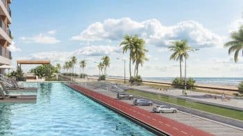 Piscina com prainha do Gal Urban Beach Living de frente para a orla de Pituaçu, com vista para o mar e área de lazer ao ar livre