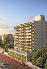 Fachada do empreendimento Gal Urban Beach Living em Salvador ao pôr do sol, com varandas verdes, arquitetura contemporânea e vista urbana