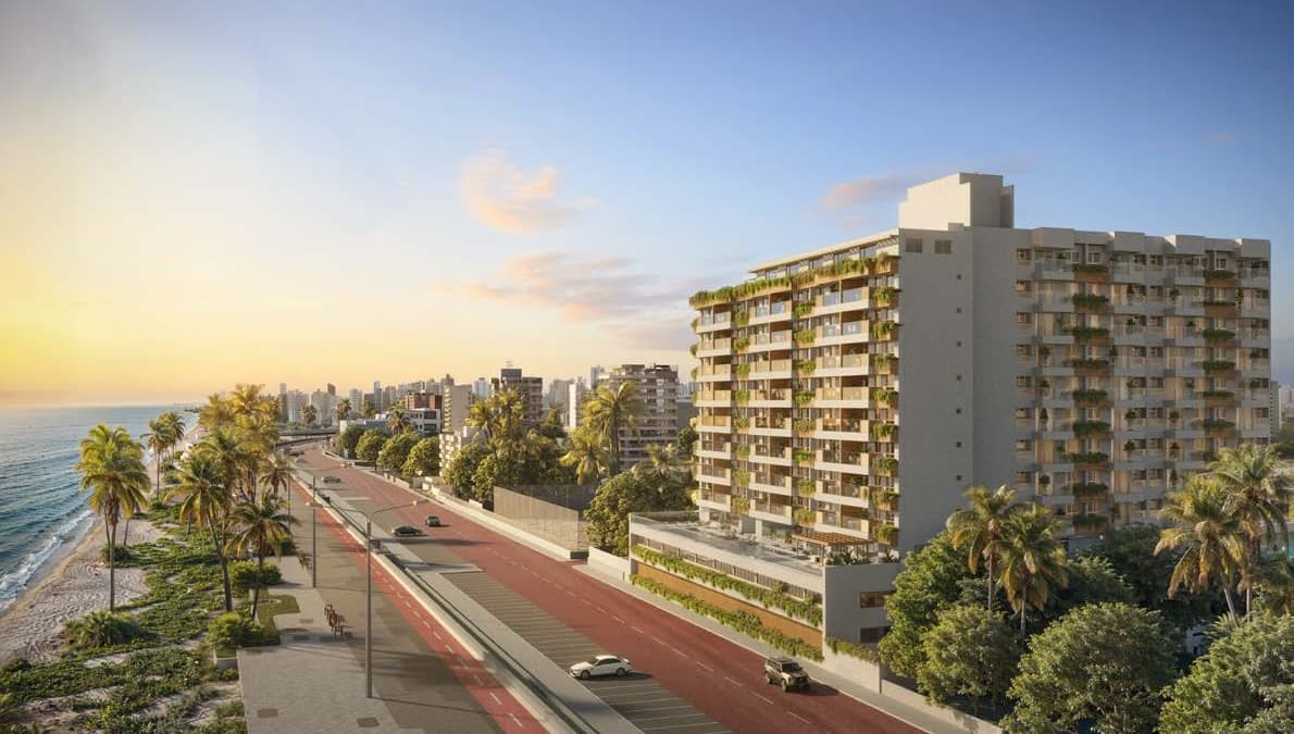 Fachada do Gal Urban Beach Living de frente para a orla de Pituaçu em Salvador, com varandas verdes e vista para o mar