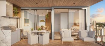 Varanda Gourmet do Lumio Jardim Apipema em Salvador (Aptos 101 a 2201, 105 a 2205), com churrasqueira, mesa de jantar e vista panorâmica da cidade.