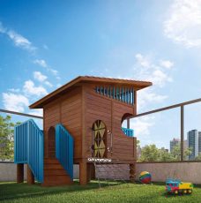 Parque infantil do Lumio Jardim Apipema em Salvador, com casinha de madeira, escorregador azul e brinquedos sobre gramado.