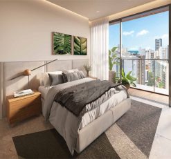 Suíte do apartamento quarto e sala do Lumio Jardim Apipema em Salvador, com decoração moderna, varanda e vista para o mar.