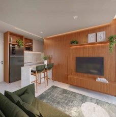 Living integrado à cozinha do Lumio Jardim Apipema em Salvador, com design moderno, marcenaria em madeira e iluminação embutida.