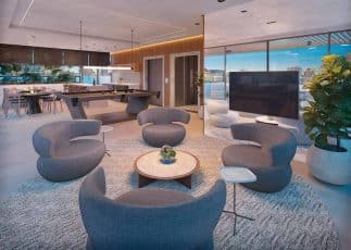 Rooftop do Lumio Jardim Apipema em Salvador, com espaço de convivência, mesa de sinuca, área gourmet e vista panorâmica para o mar.