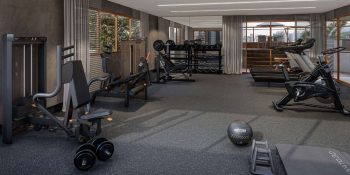 Academia equipada do Vivid Pituba com esteiras, bicicletas e estação de musculação