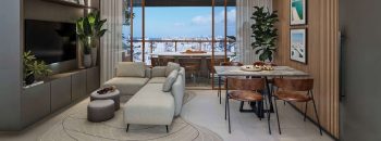 Sala de estar e jantar integrada à varanda gourmet do Vivid Pituba com vista panorâmica de Salvador