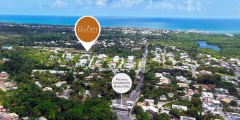 Vista aérea mostrando a localização do Reserva Byom em Busca Vida, próxima à portaria do condomínio e ao litoral norte da Bahia.