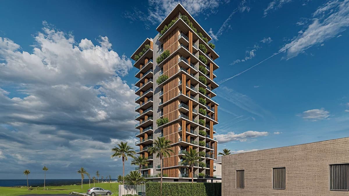 Torre residencial do Yu Corsário Smart Hub com arquitetura contemporânea, varandas verdes e localização privilegiada na nova orla de Salvador.