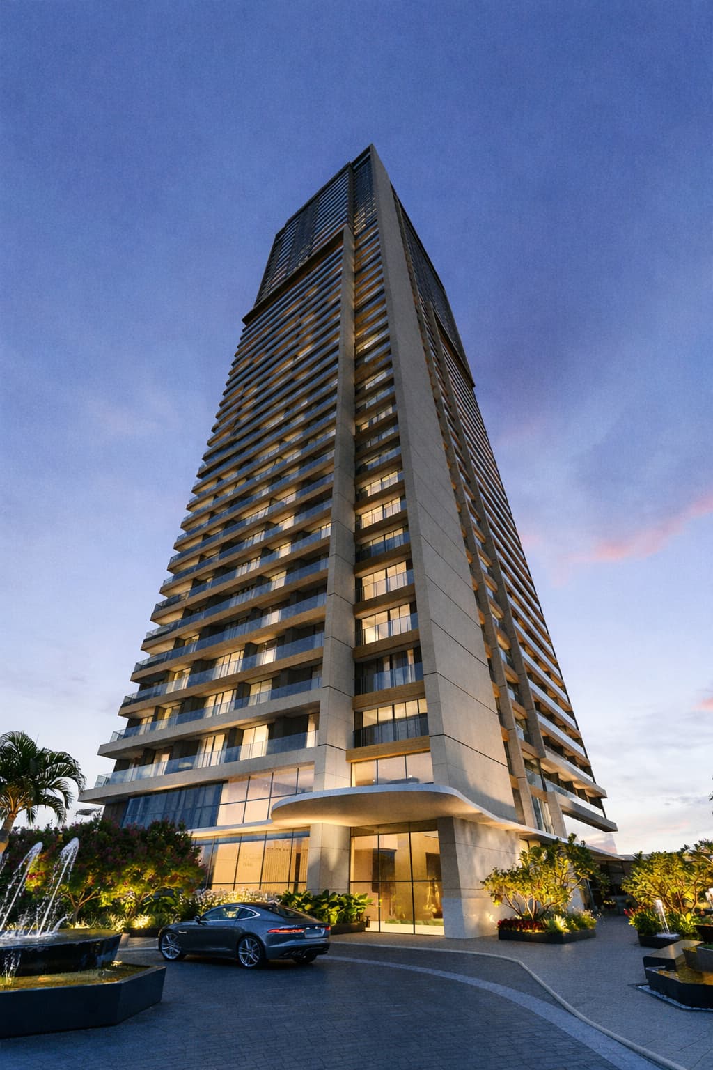 Fachada do edifício Beach Class Bahia, torre residencial moderna com varandas, iluminação cênica, paisagismo e acesso porte-cochère na entrada principal