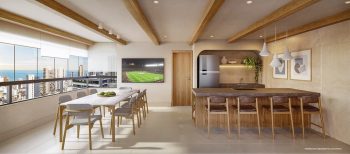 Espaço gourmet no rooftop do OCEAN Jardim Brasil, com mesa coletiva, bancada integrada e vista para a Barra, em Salvador.