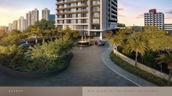Acesso do Beach Class Bahia pela Rua Clarival do Prado Valadares, com porte-cochère, paisagismo e entrada exclusiva no Caminho das Árvores, Salvador.