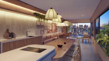 Espaço gourmet moderno com bancada, mesa longa e vista panorâmica da cidade ao entardecer.