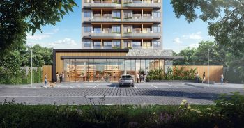 Fachada térrea do House Macapá 211 em Ondina, Salvador, com entrada moderna, paisagismo e área de convivência