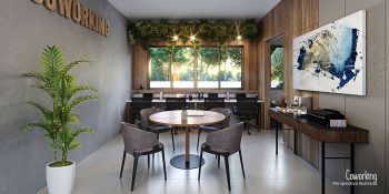 Espaço de coworking equipado no Blue Sea Smart Living com mesas, cadeiras e ambiente confortável para trabalho