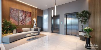 Hall de elevadores do Blue Sea Smart Living com sofás, decoração moderna e acesso aos elevadores
