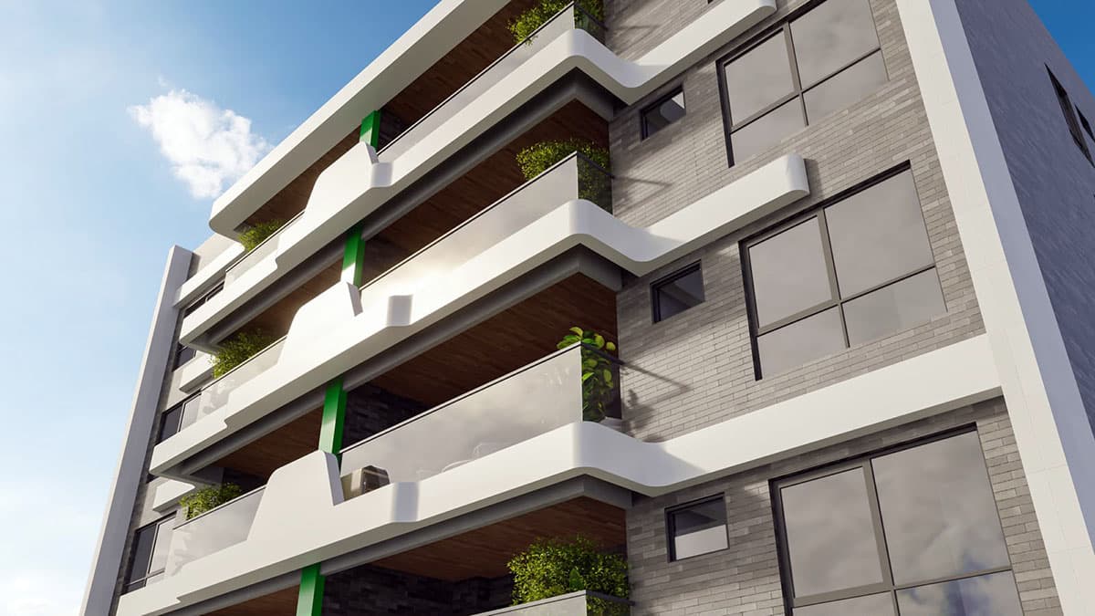 Perspectiva da fachada do TOM Colina de Patamares com varandas amplas, guarda-corpo em vidro, arquitetura contemporânea e acabamentos de alto padrão.