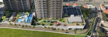Vista aérea do lazer do Mood Sol Bahia com piscinas, parque infantil, quadra recreativa, jardins, espaços gourmet e torre residencial.